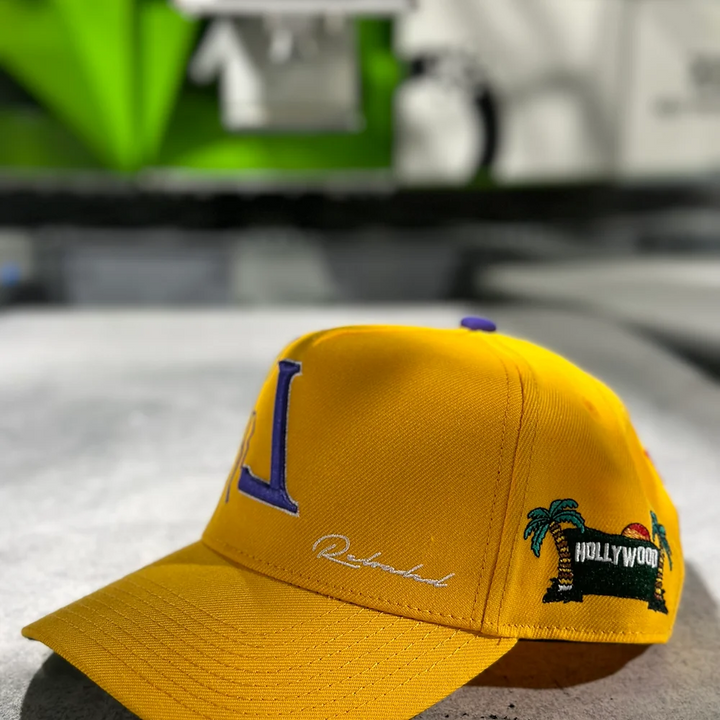 YELLOW L.A. ALL OVER EMBROIDERY SNAP BACK
